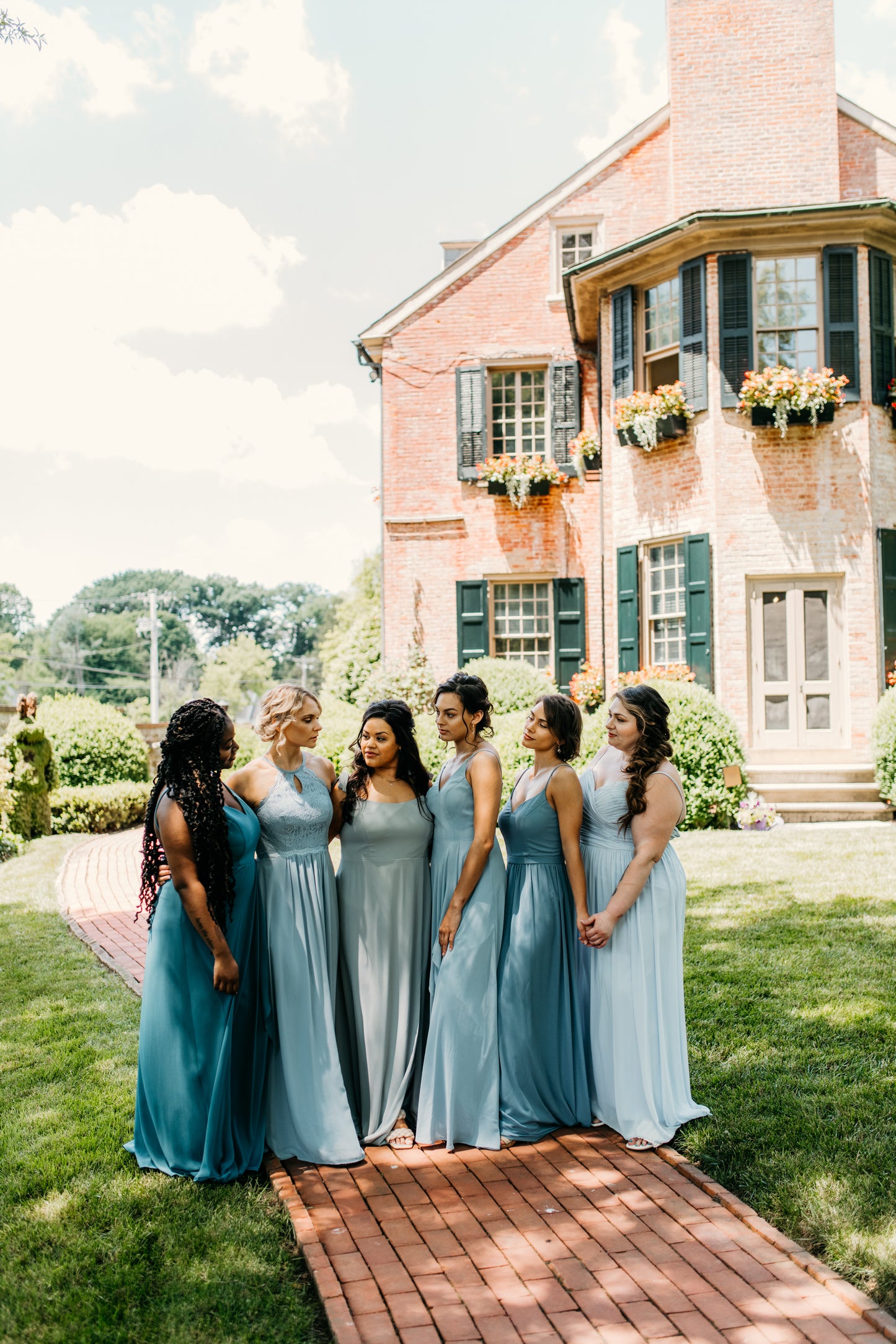 Mia (second from right) wears the Rachel Dress