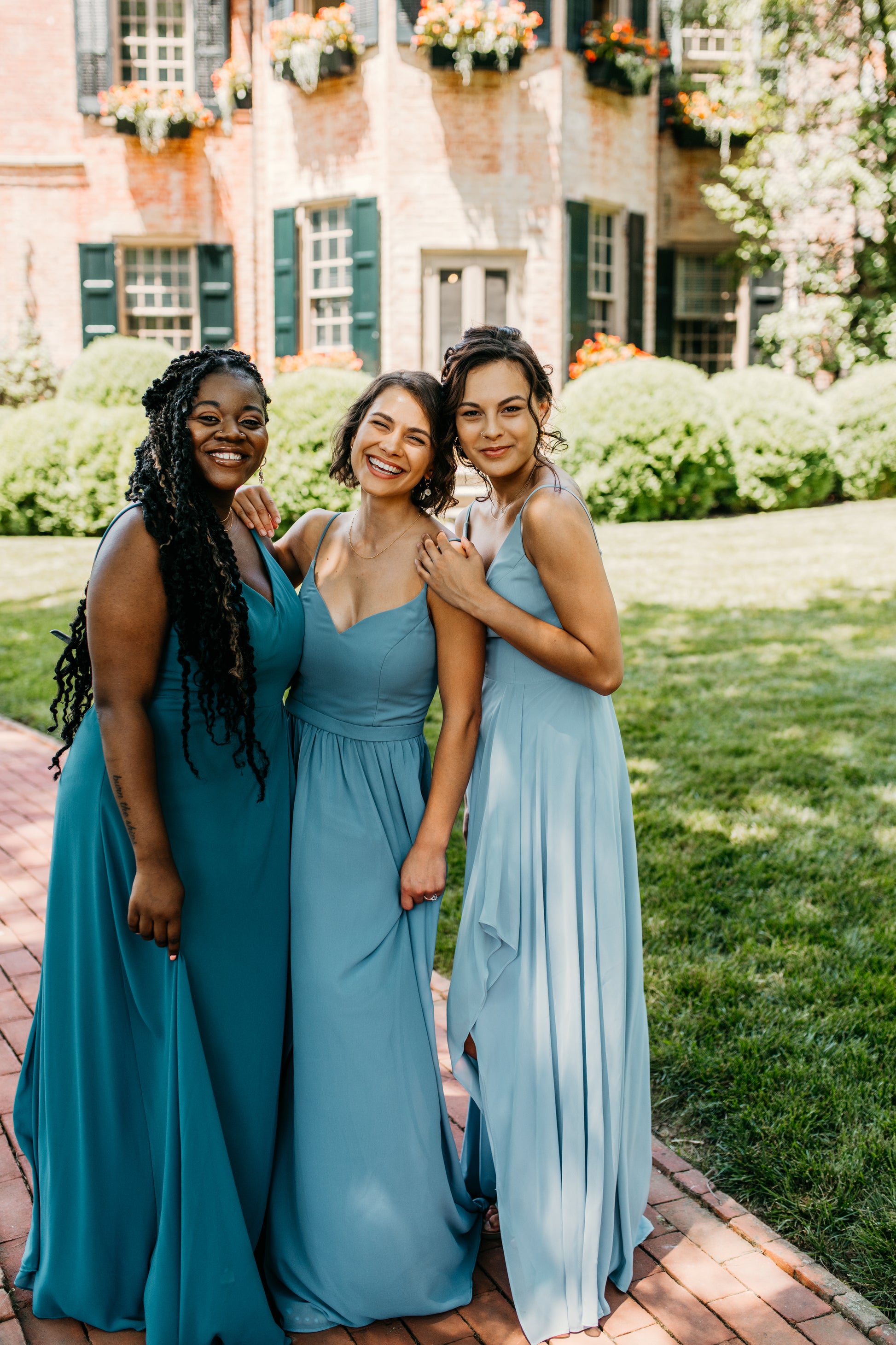 Mia (center) wears the Rachel Dress