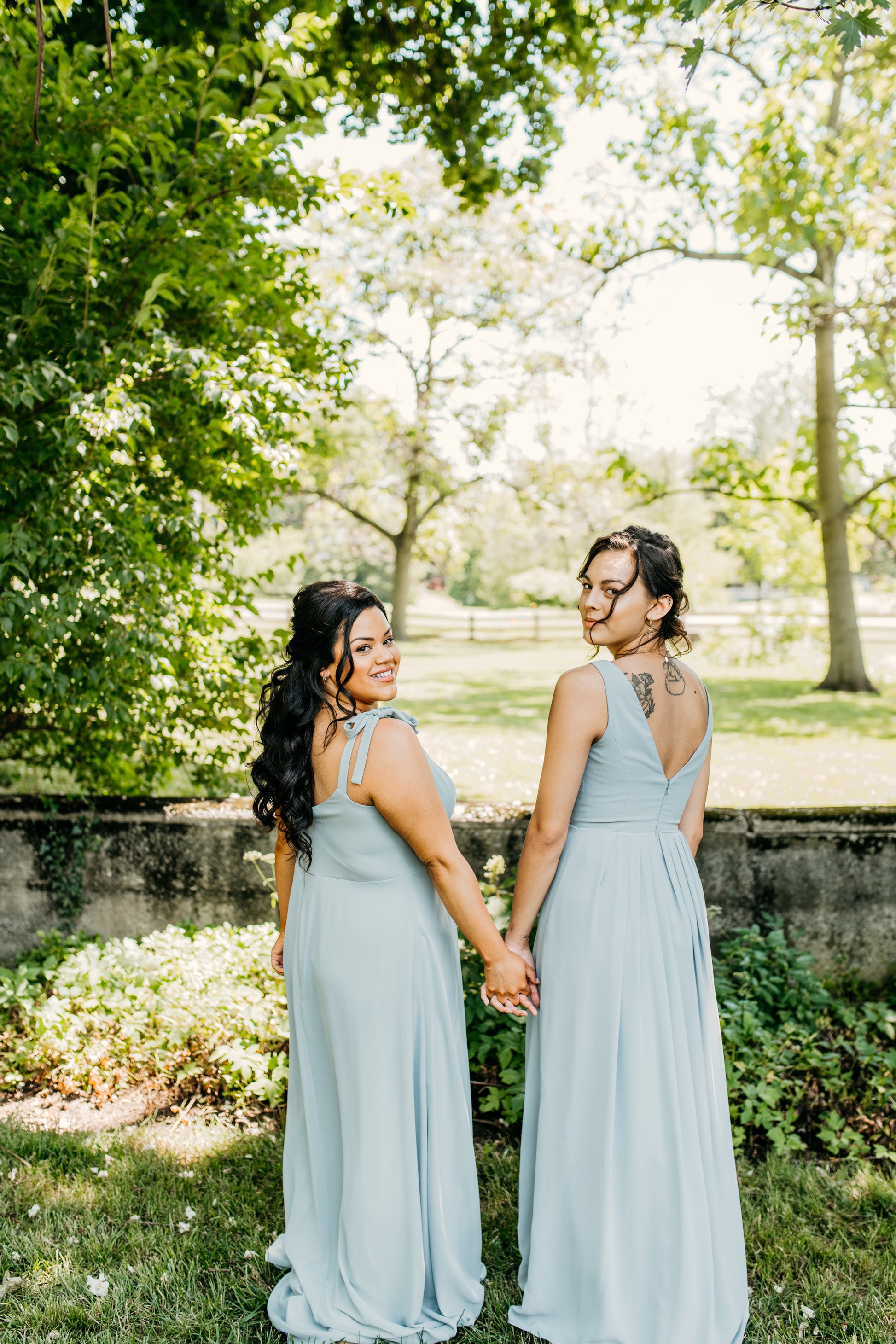 Jasmine (left) wears the Camilla dress