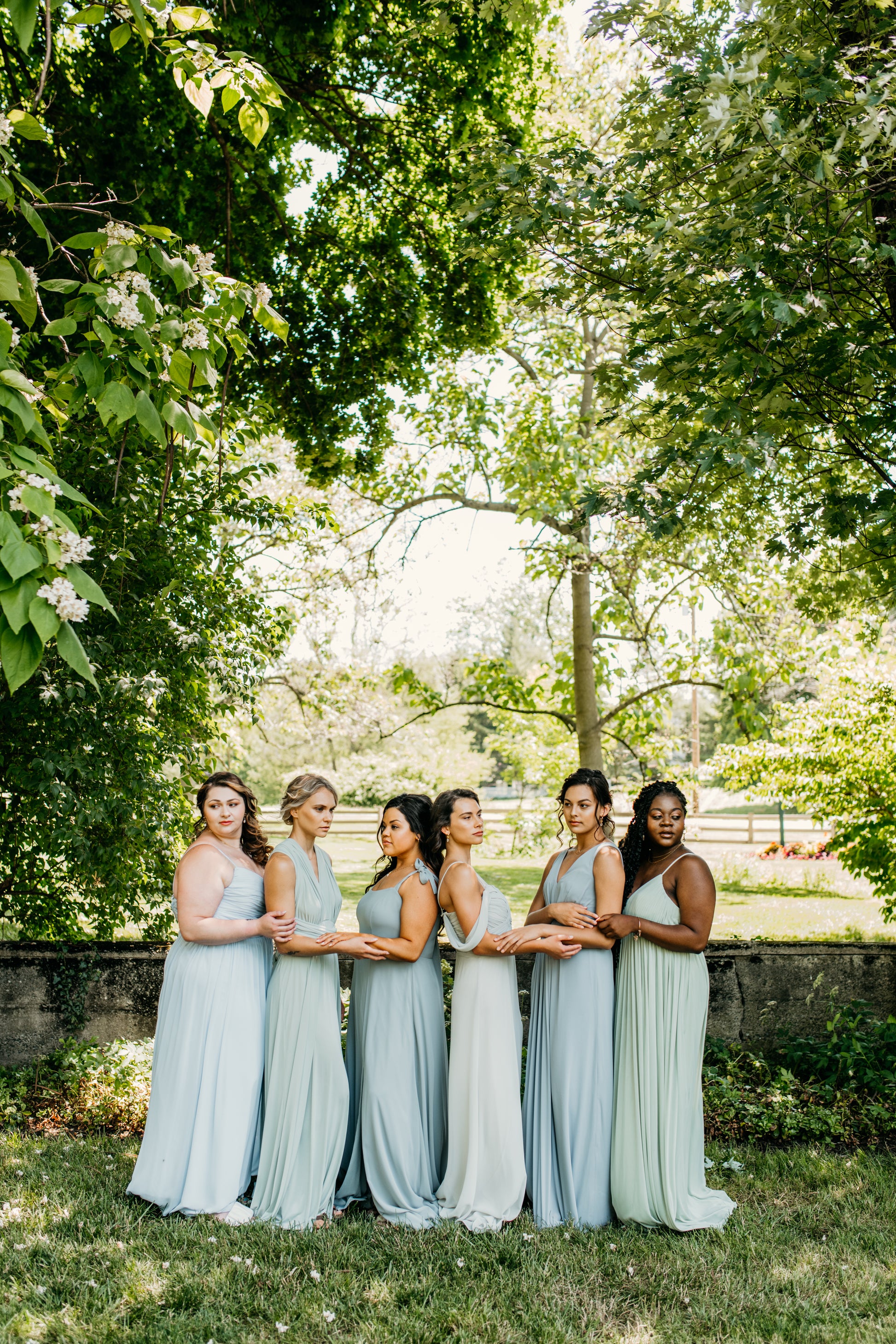 Mia (third from right) wears the Taylor Dress