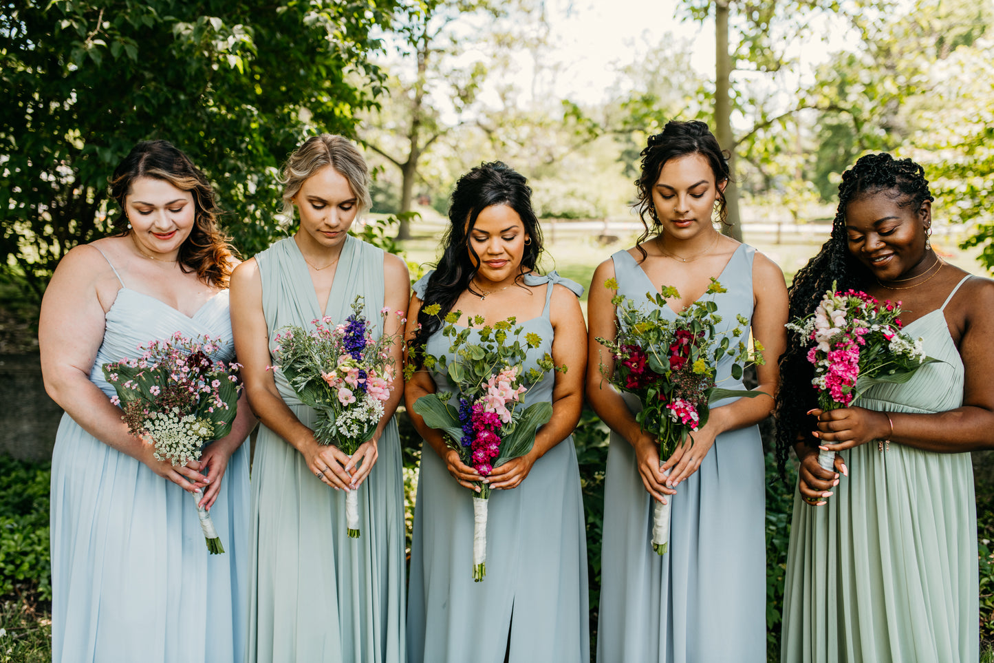 Katie (far left) wears the Jill Dress
