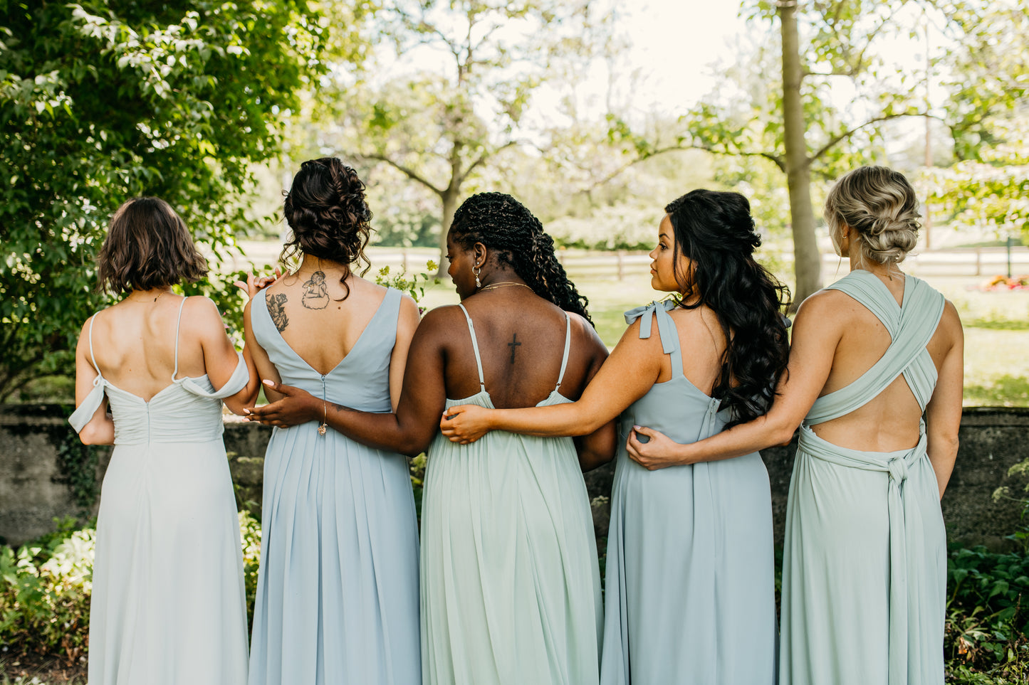 Jess (center) wears the Ryleigh Dress