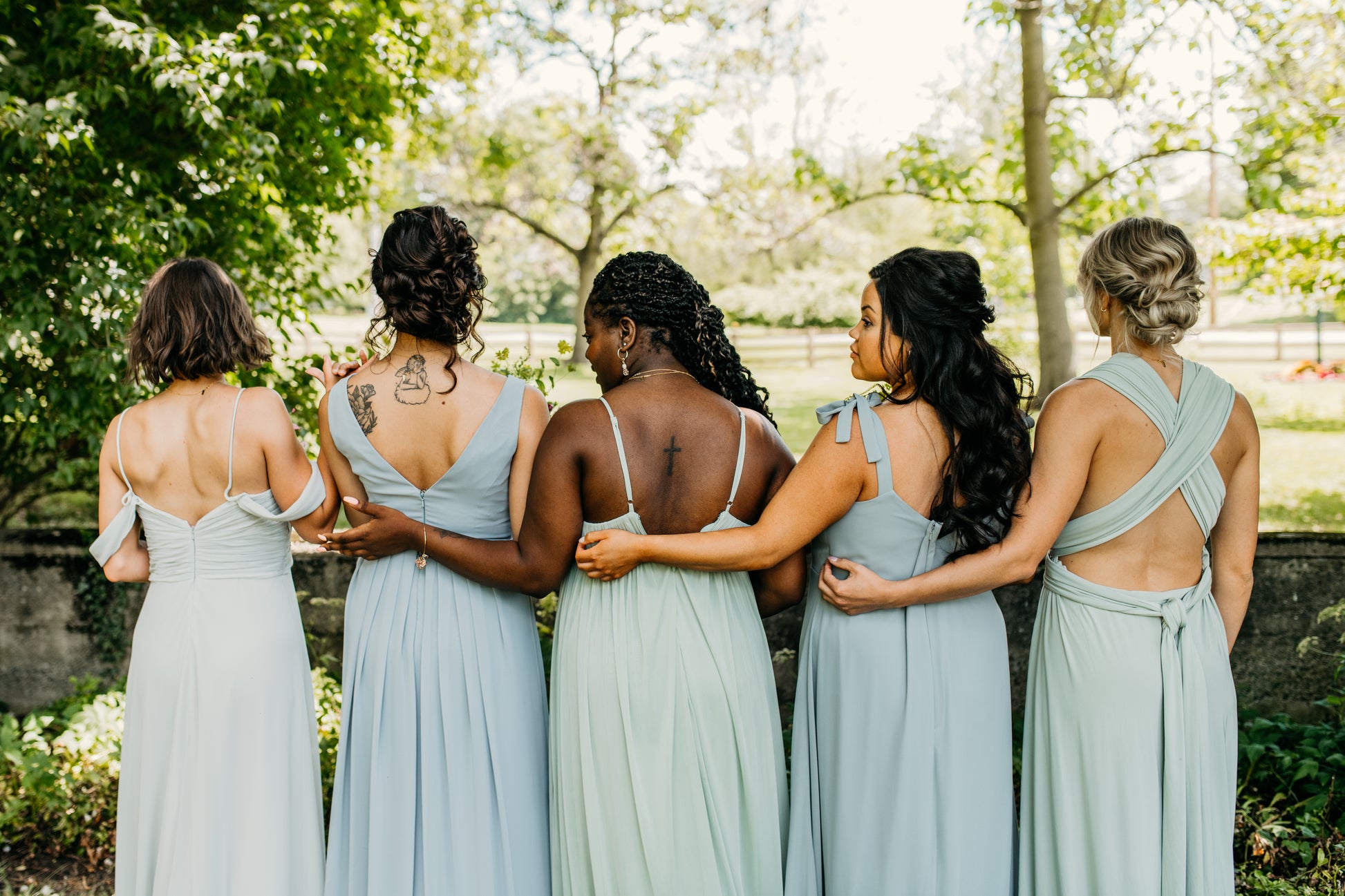 Jess (center) wears the Ryleigh Dress