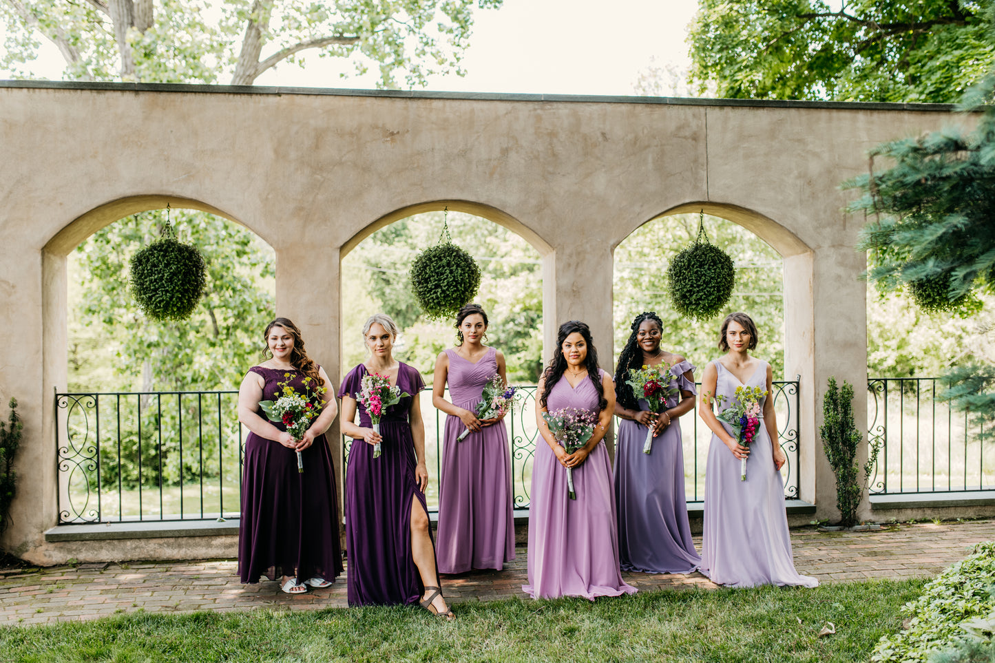 Mia (far right) wears the Madison dress