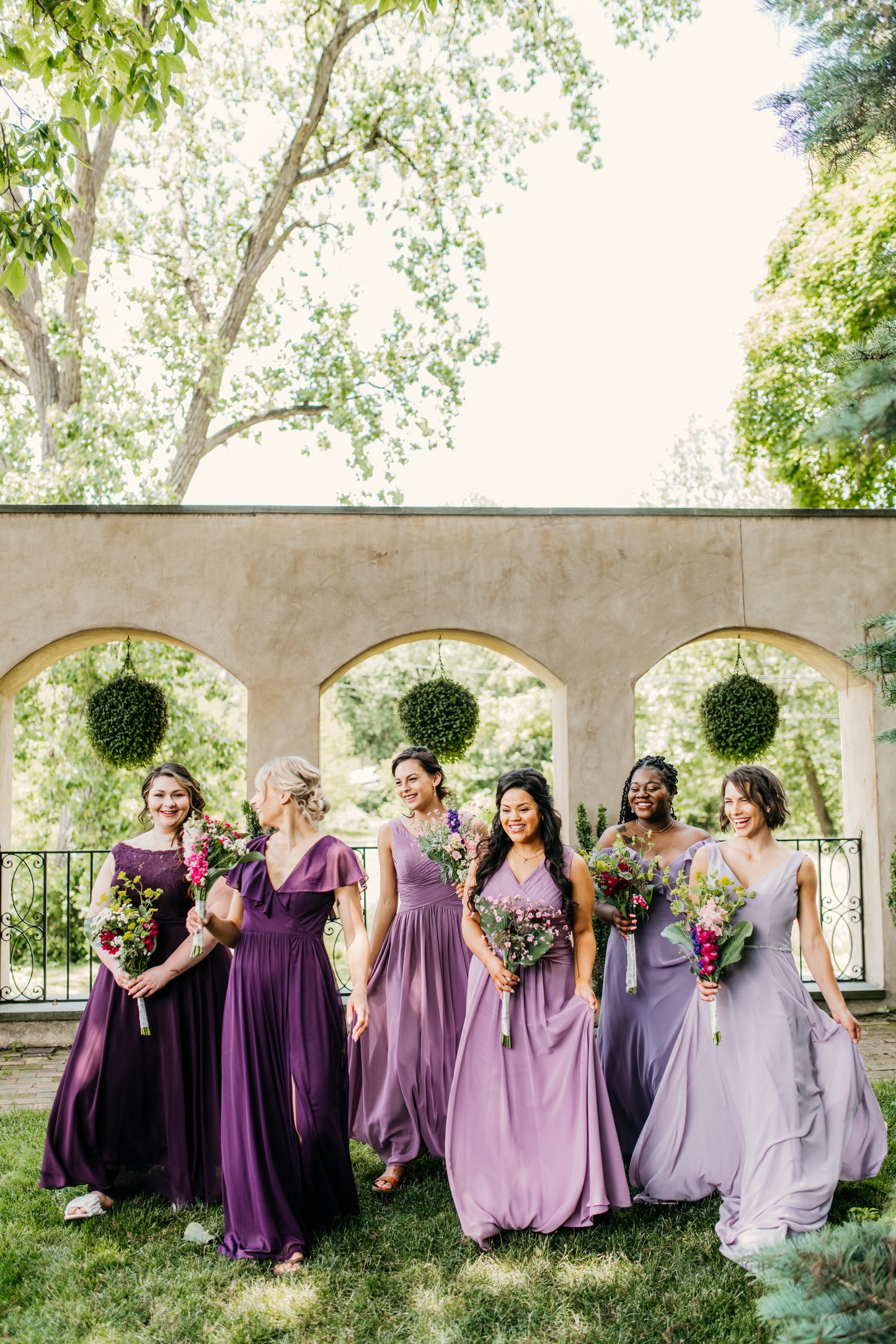 Mia (far right) wears the Madison dress
