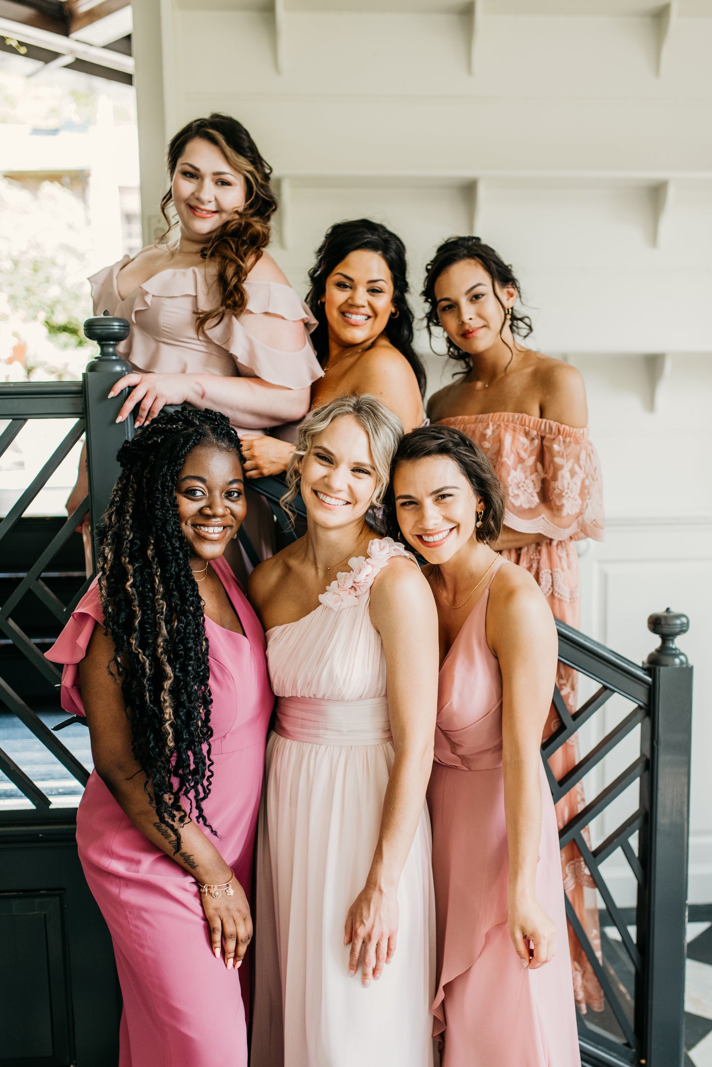 Erin (center, lower level) wears the Grace dress