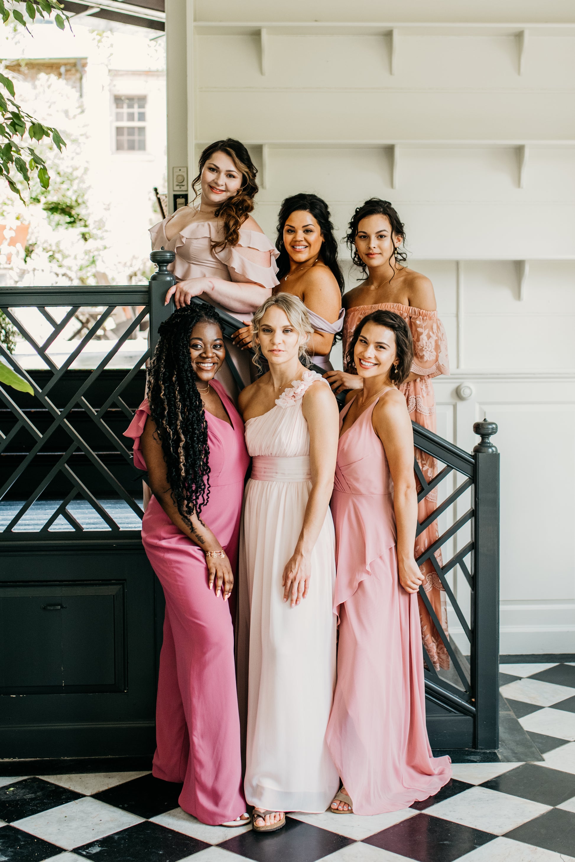 Jess (bottom left) wears the Leah Jumpsuit
