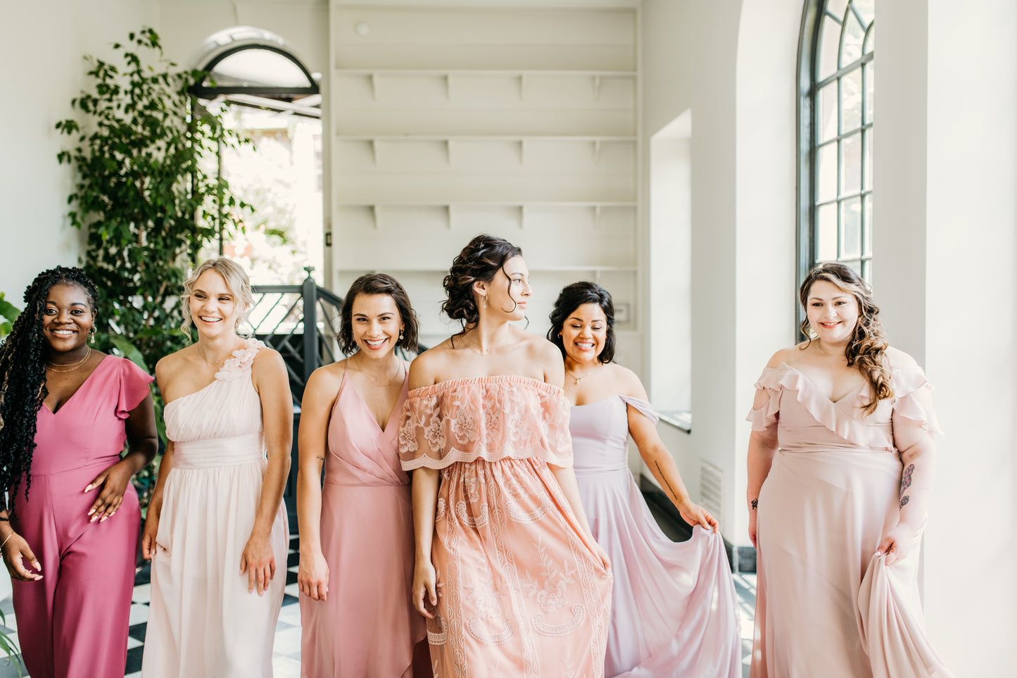 Erin (second from left) wears the Grace dress