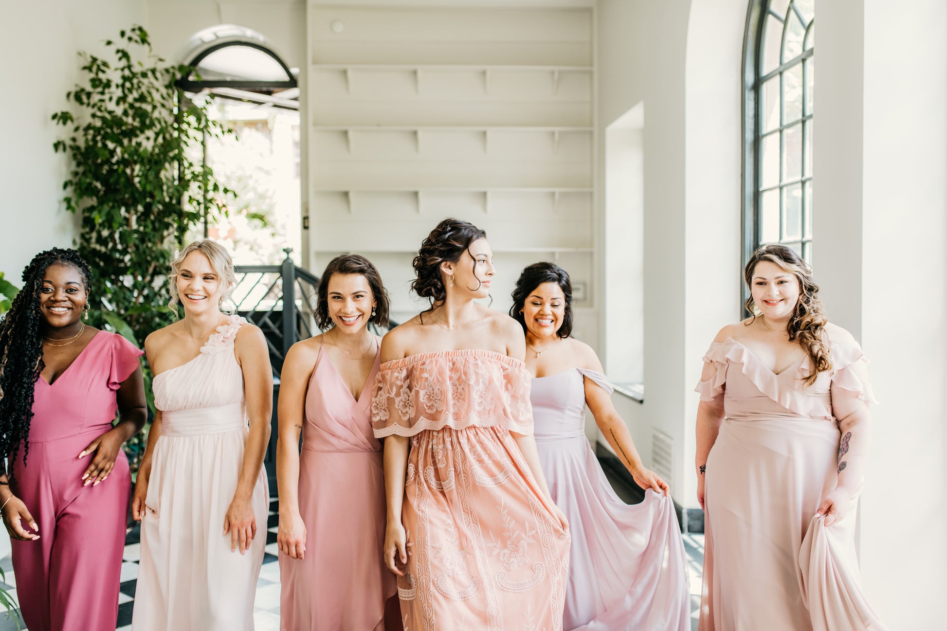 Erin (second from left) wears the Grace dress