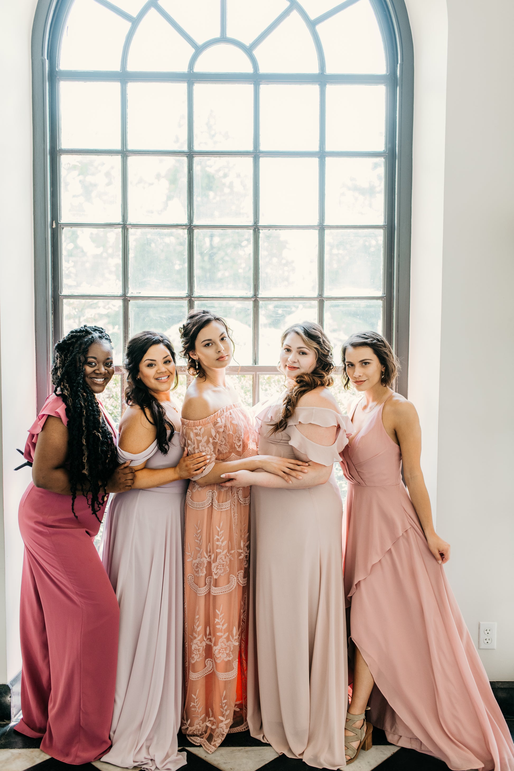 Jess (far left) wears the Leah Jumpsuit