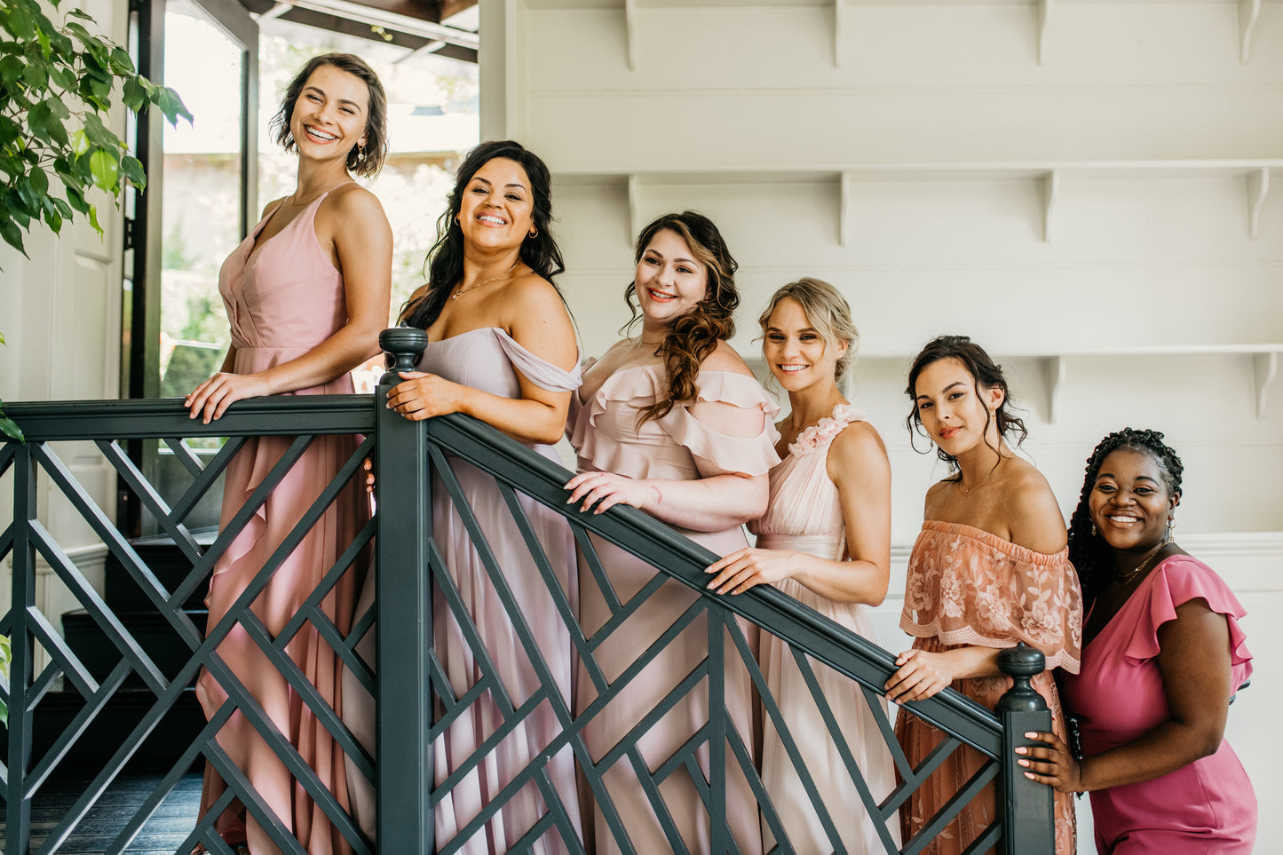 Erin (third from right) wears the Grace dress