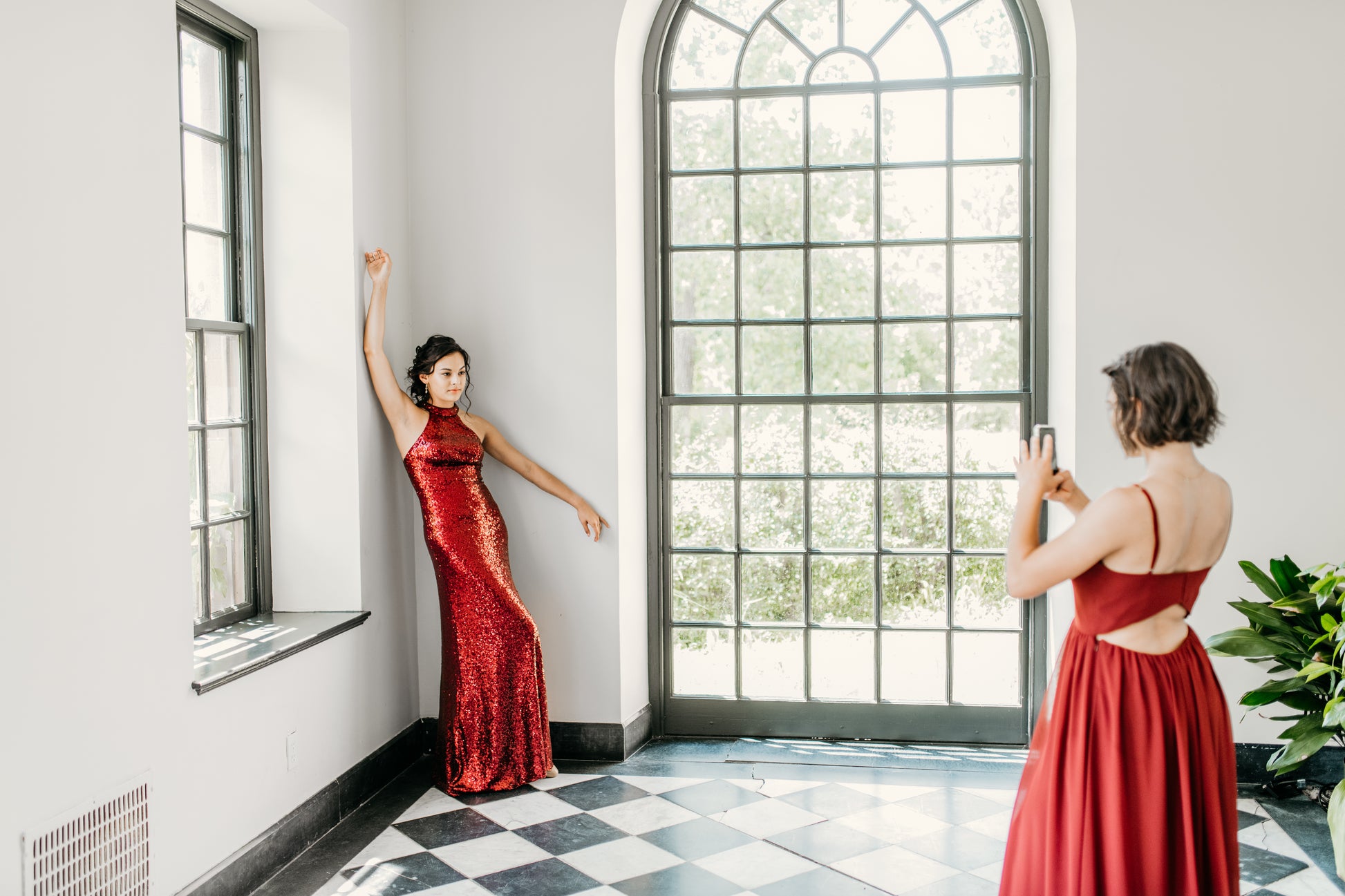 Mia (right) wears the Vivian Dress