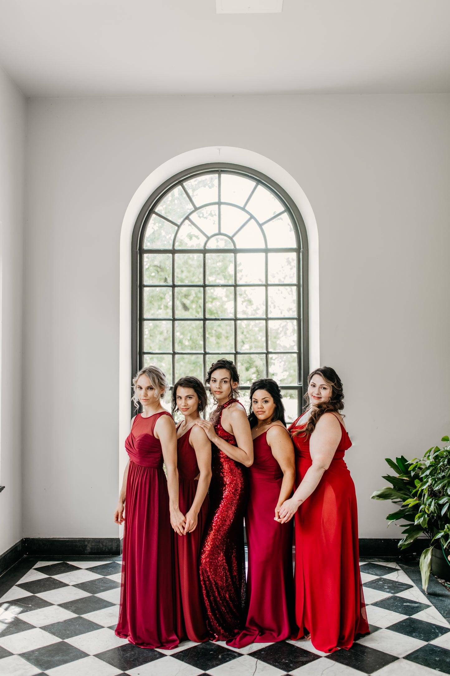 Erin (far left) wears the Athena Dress