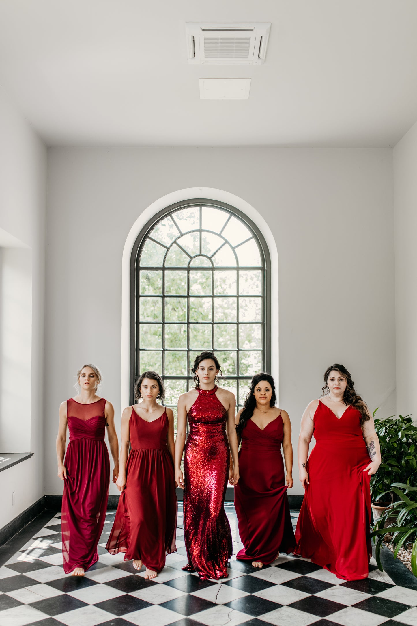 Erin (far left) wears the Athena Dress