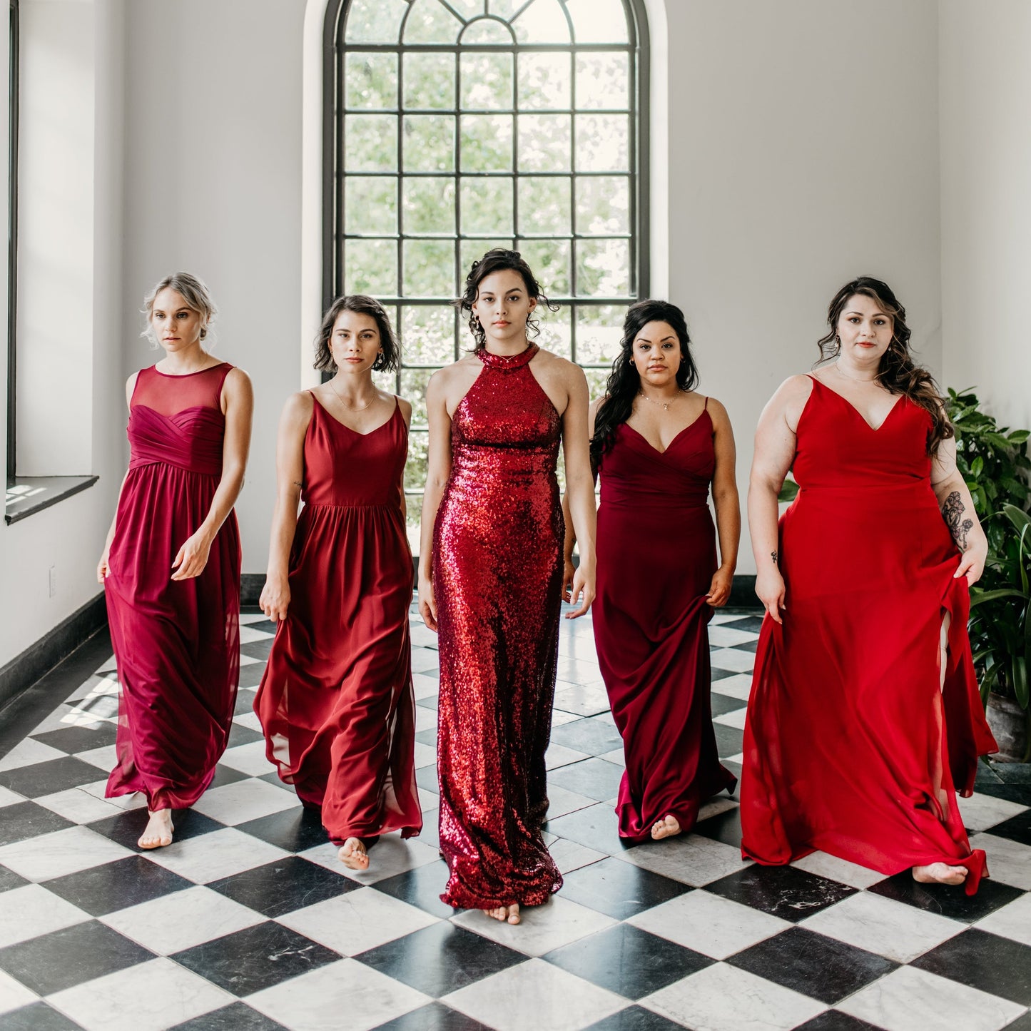 Mia (second from left) wears the Vivian Dress