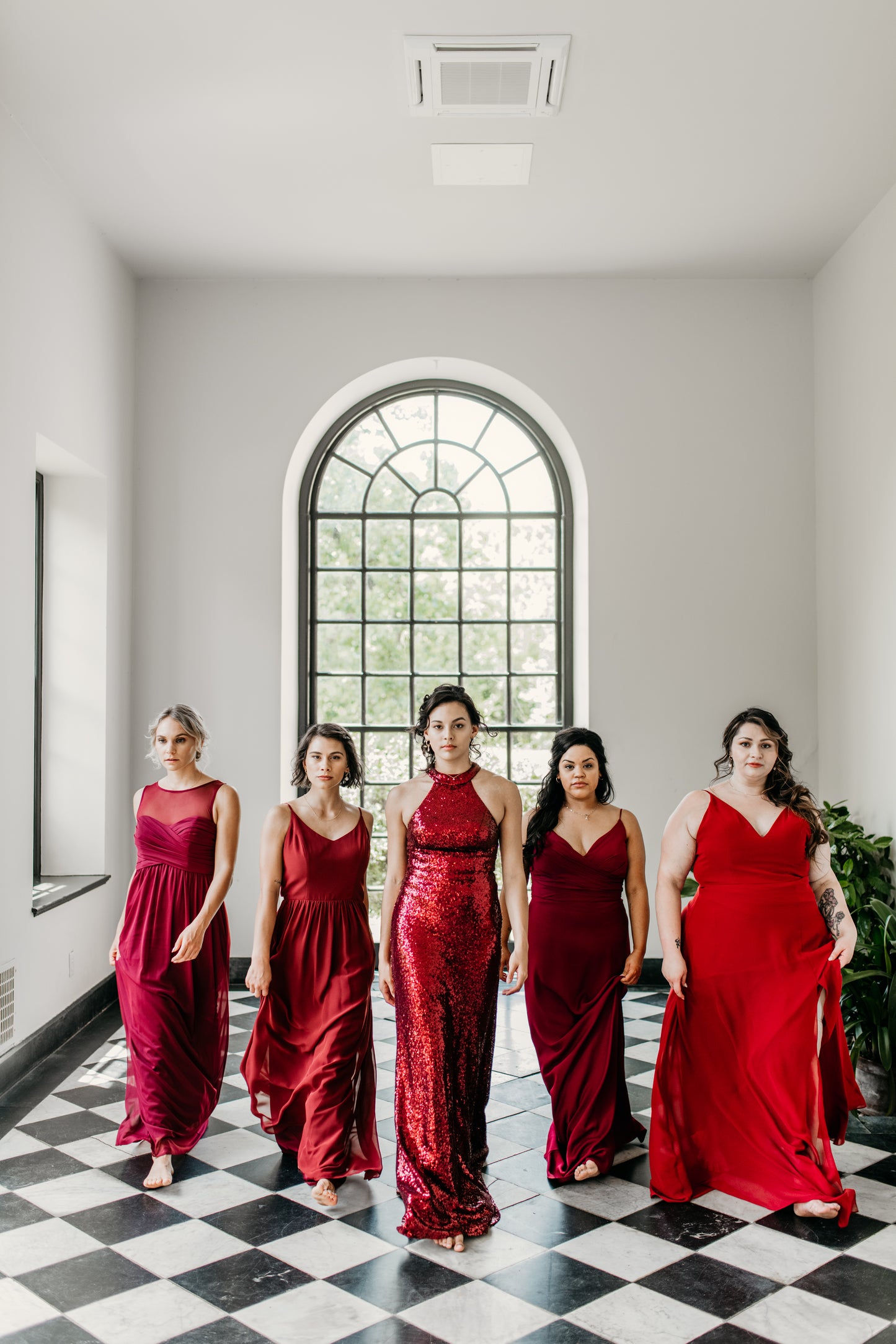 Erin (far left) wears the Athena Dress