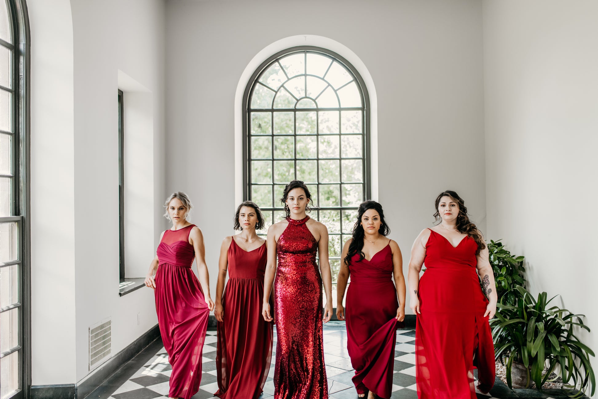 Erin (far left) wears the Athena Dress