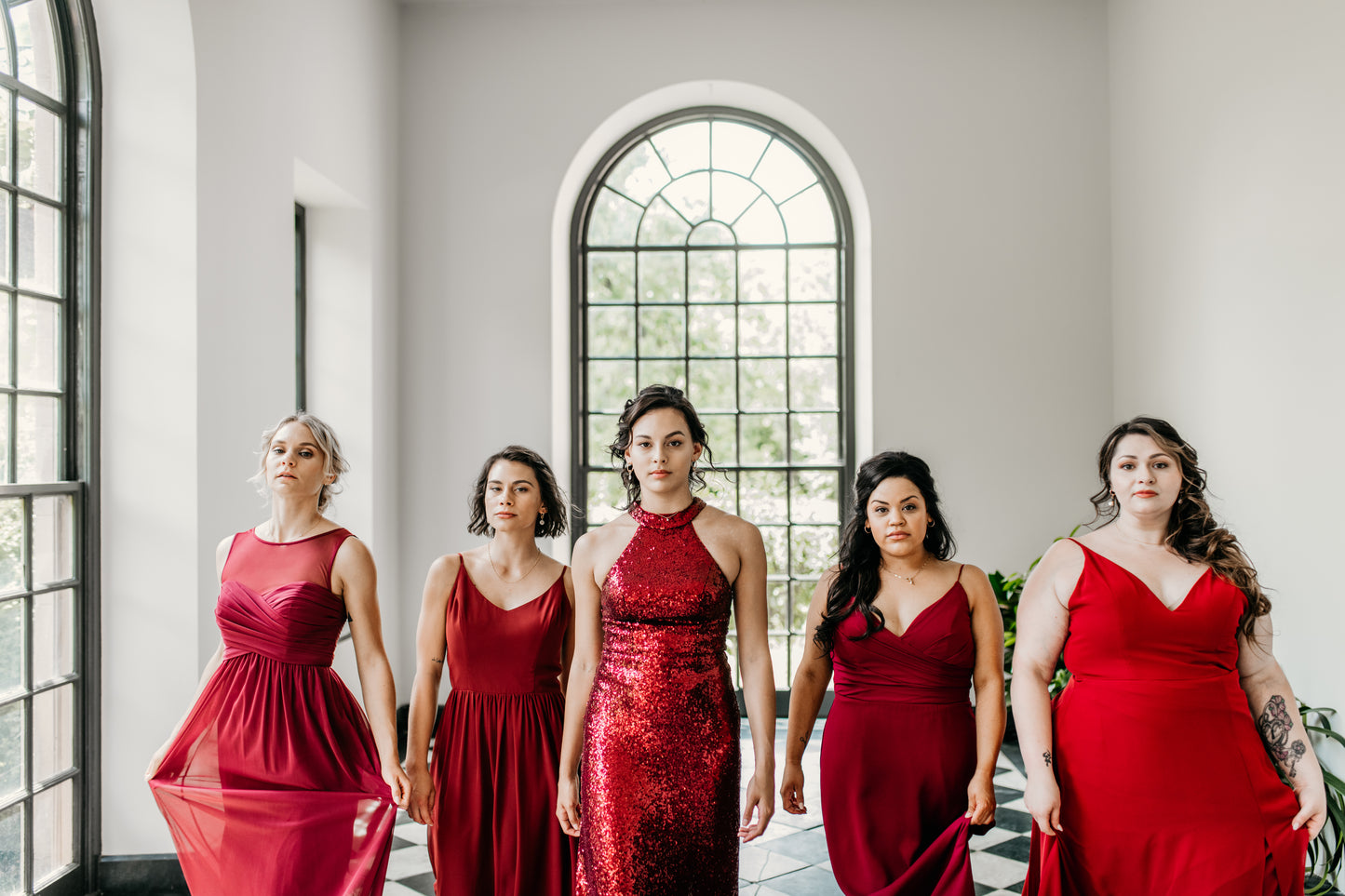 Hope (center) wears the Lydia Dress