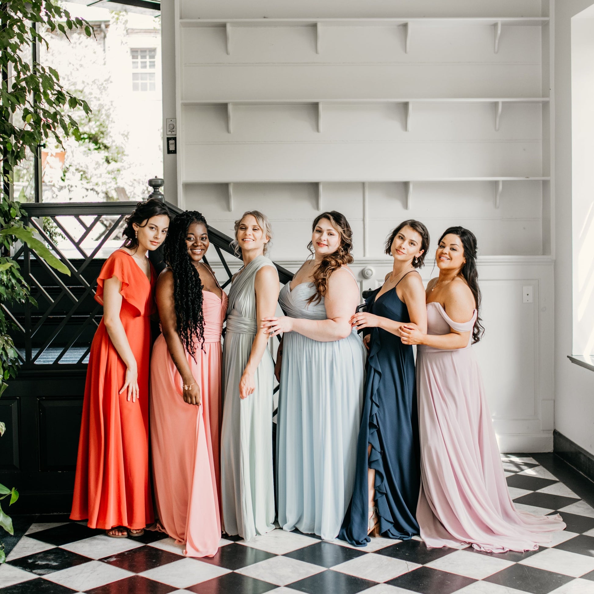 Erin (third from left) wears the Juliana Dress