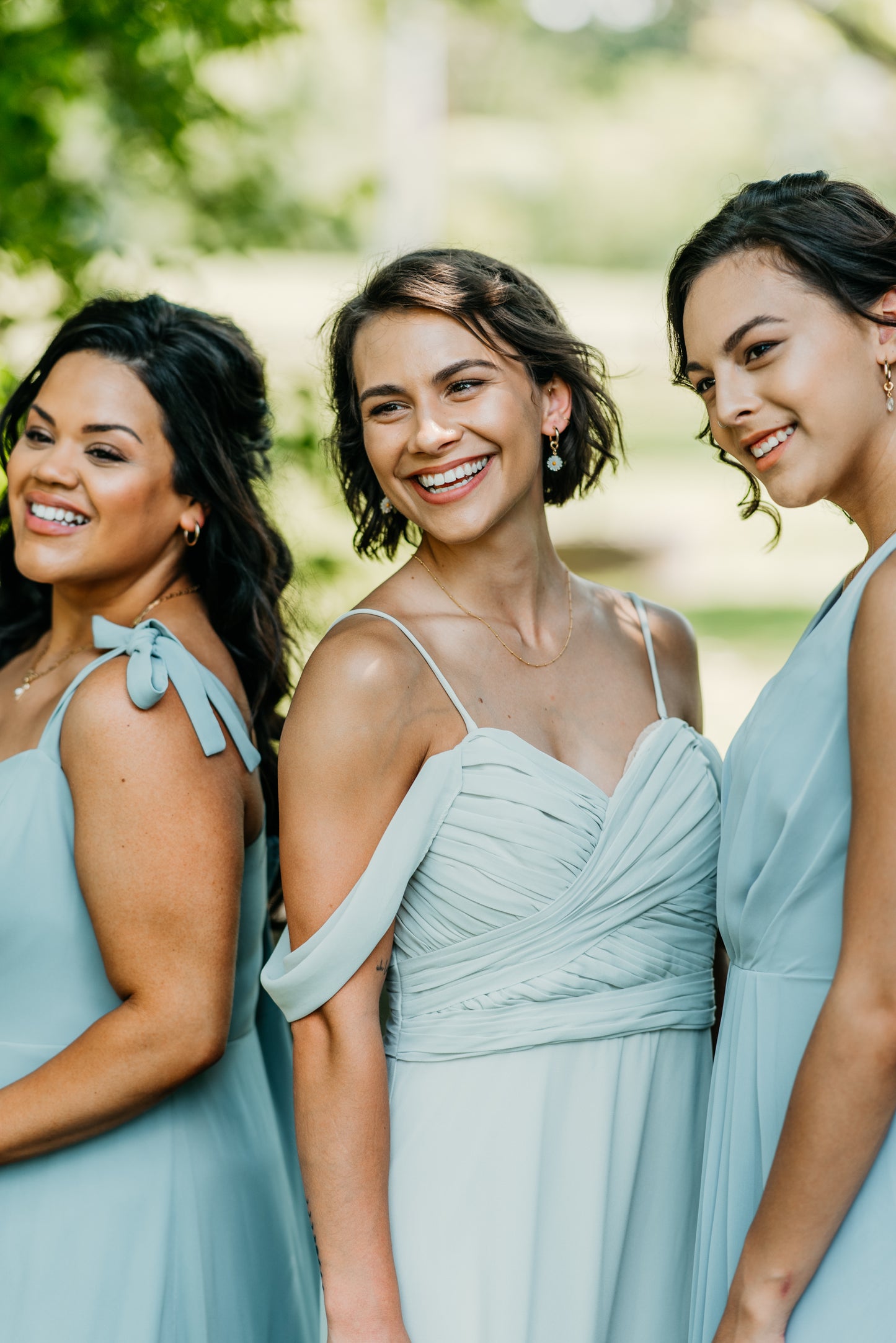 Mia (center) wears the Taylor Dress