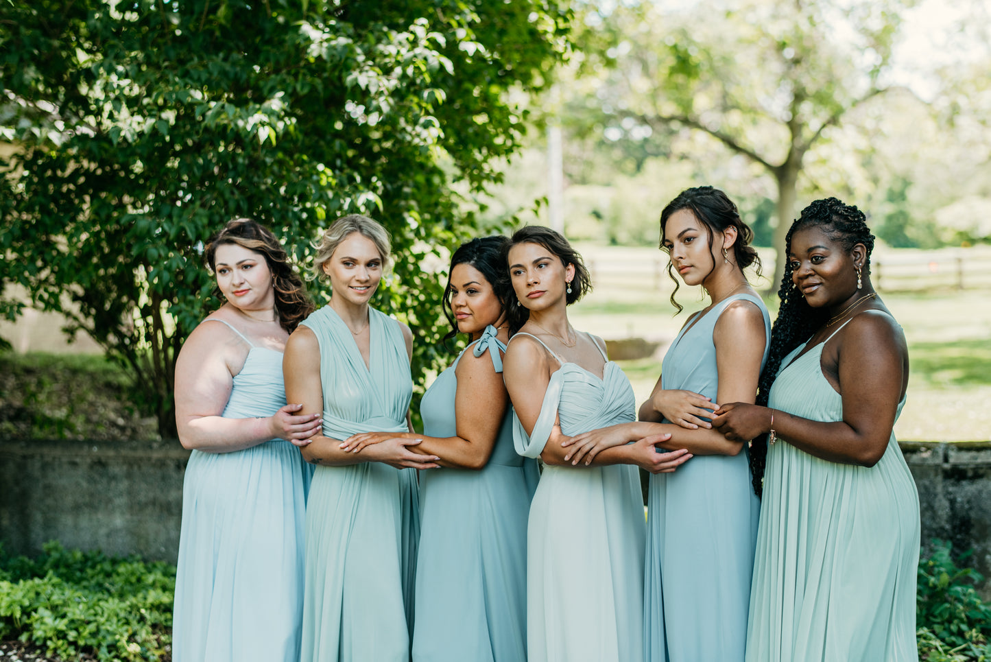 Jess (far right) wears the Ryleigh Dress