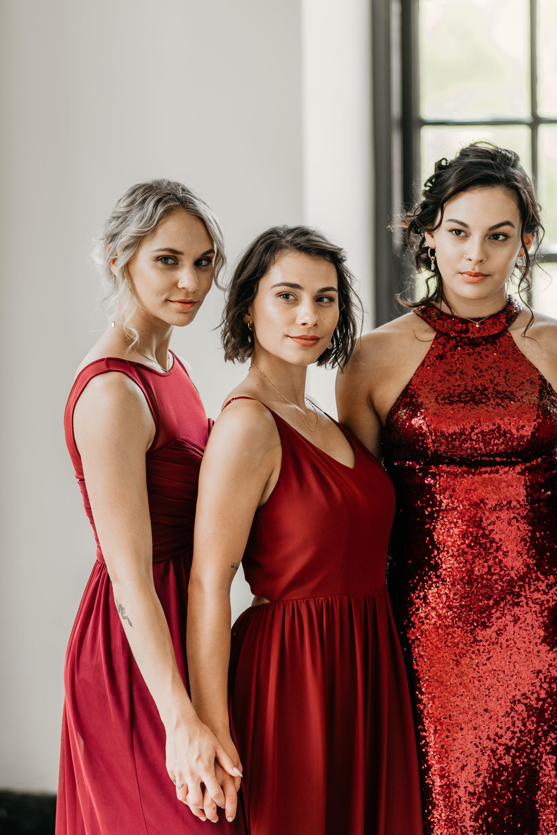 Erin (far left) wears the Athena Dress