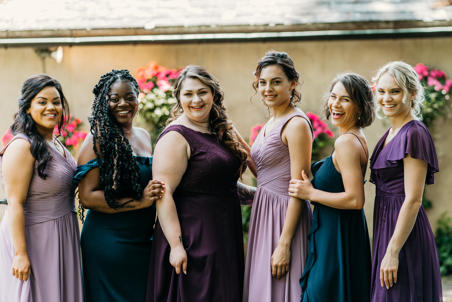 Erin (far right) wears Elizabeth dress