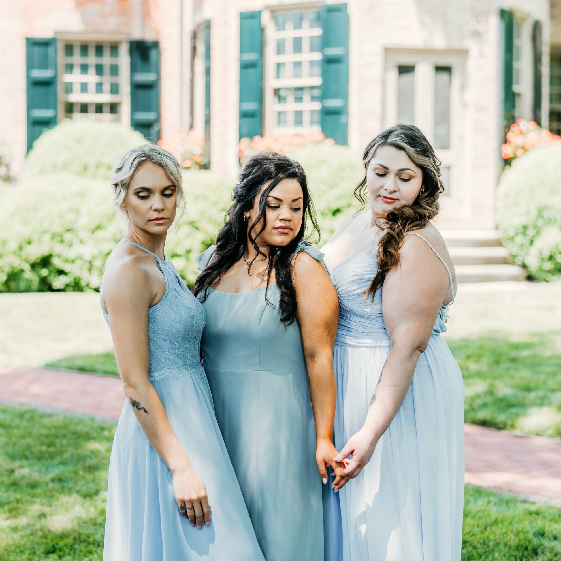 Erin (left) wears the Lila Dress