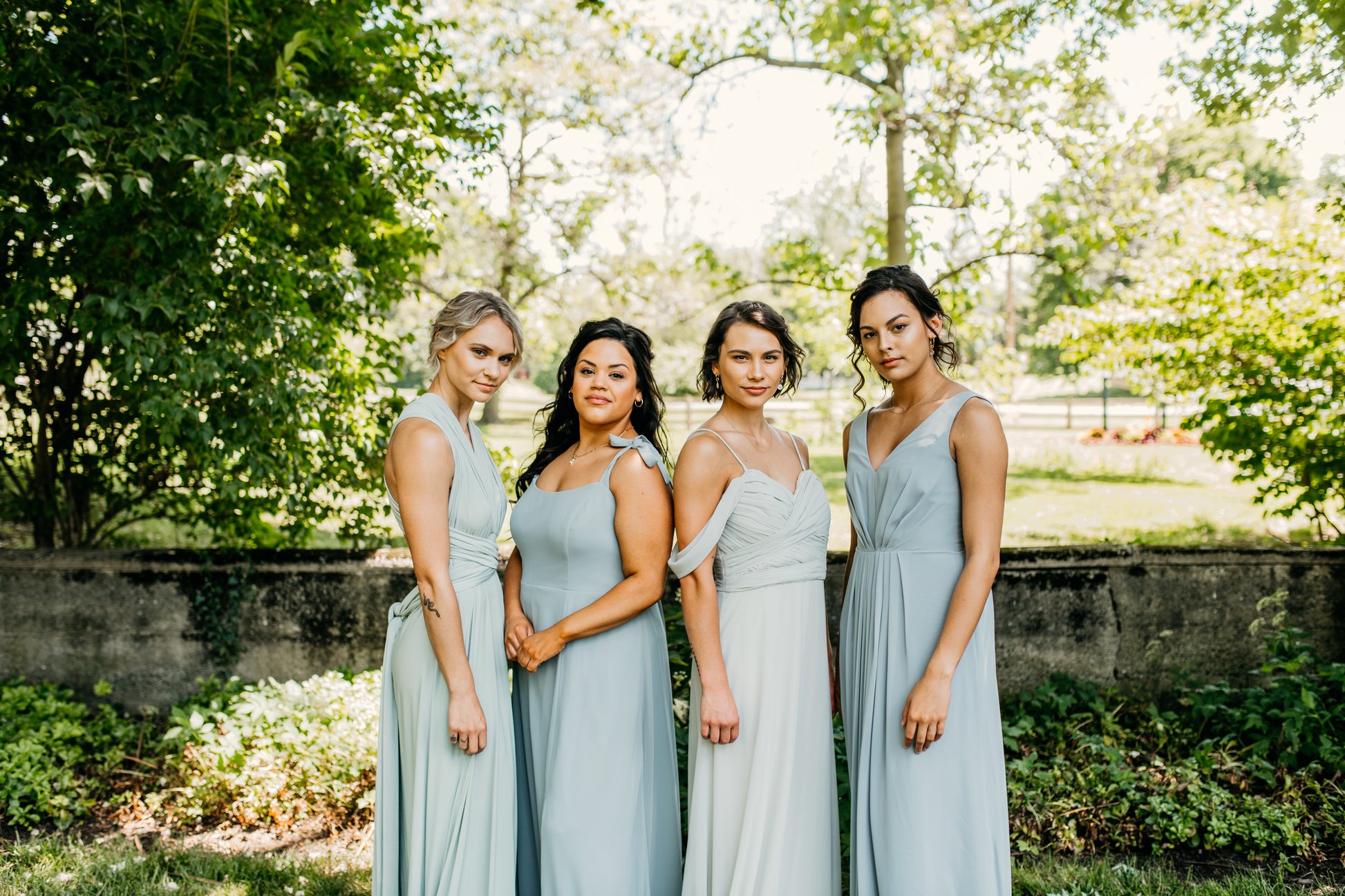 Jasmine (second from left) wears the Camilla dress