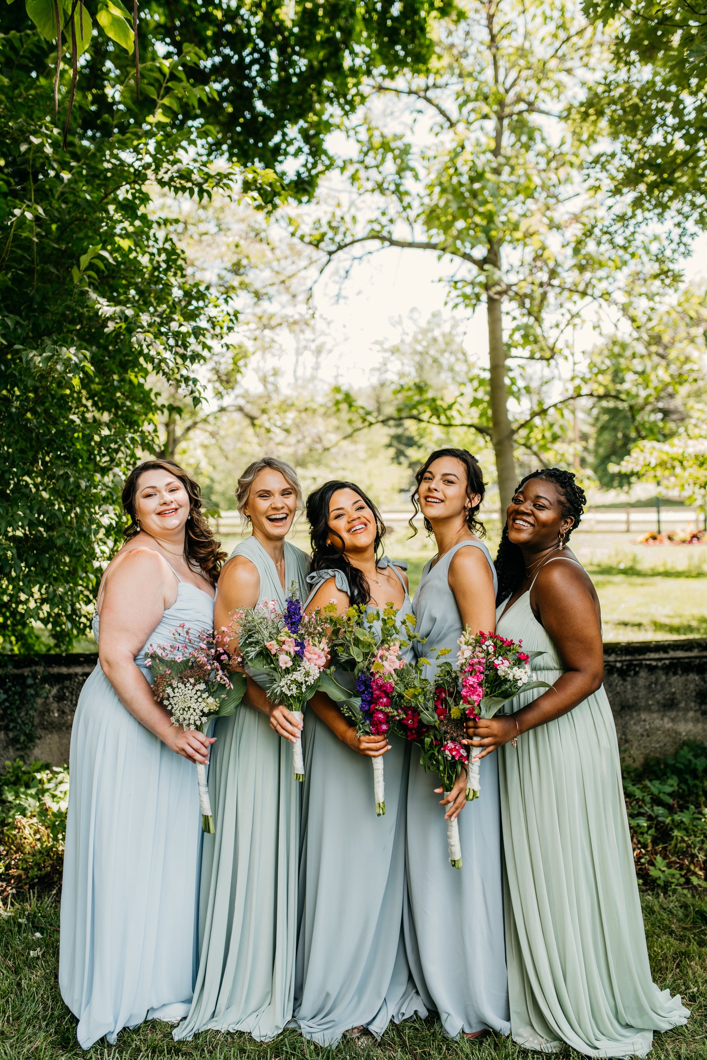 Katie (far left) wears the Jill Dress