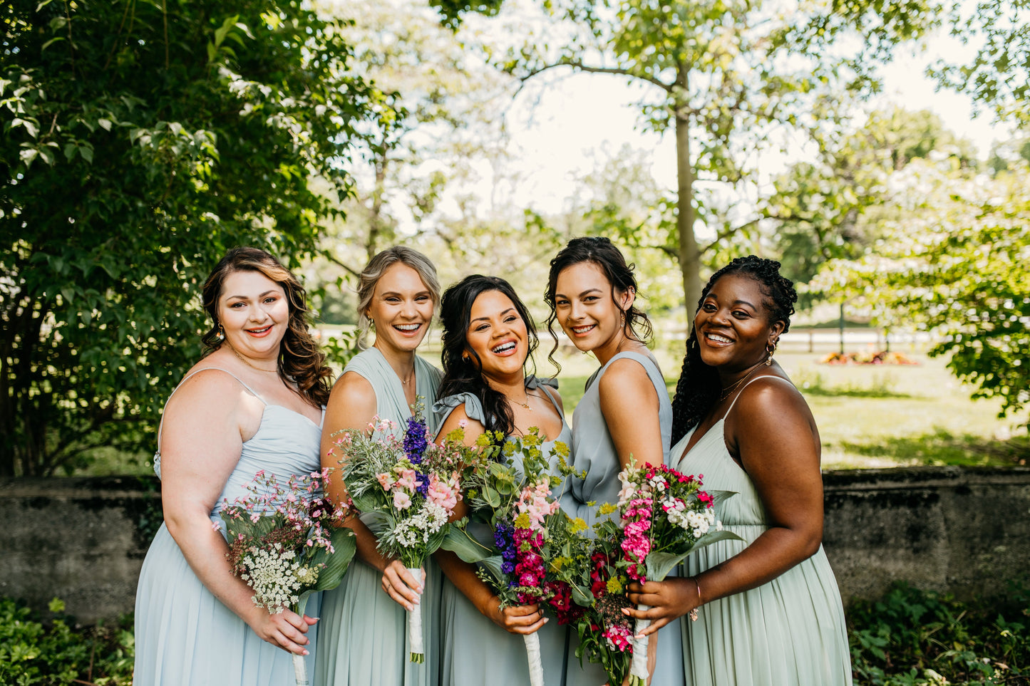 Katie (far left) wears the Jill Dress