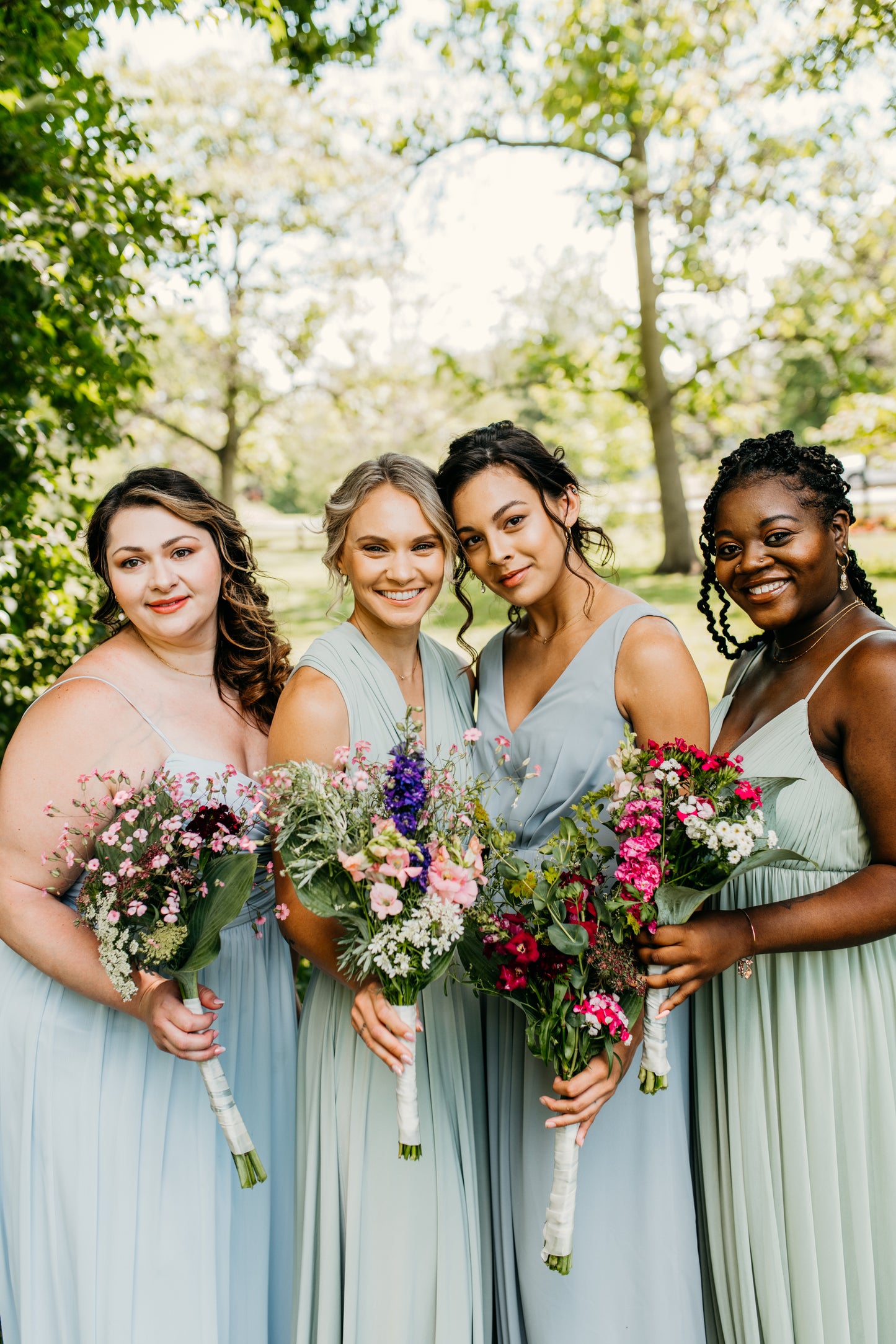 Katie (far left) wears the Jill Dress