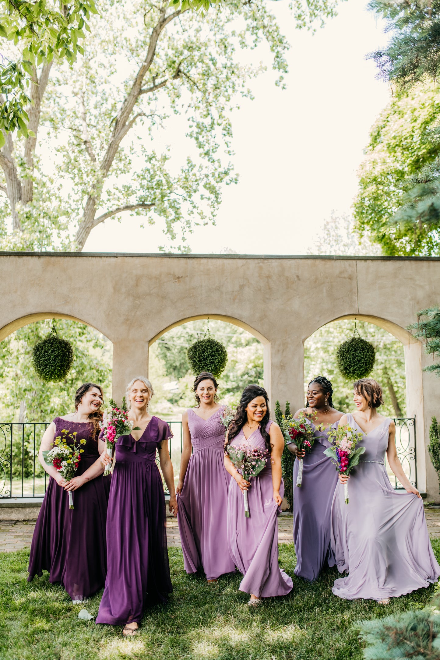 Mia (far right) wears the Madison dress