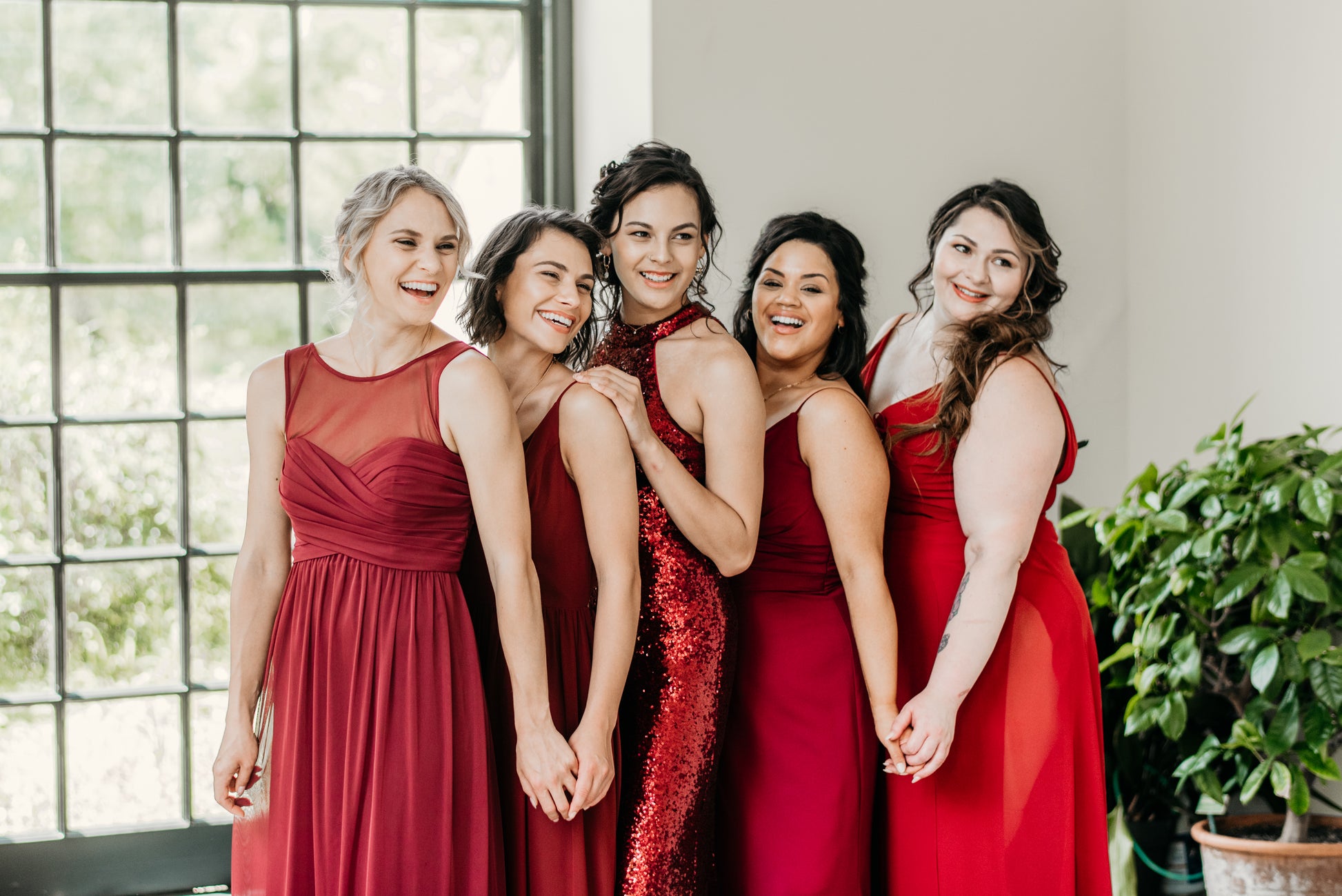 Erin (far left) wears the Athena Dress